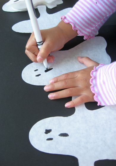 How to Make Paper Ghost Garlands for Halloween (draw faces) by Cindy Hopper for Alphamom.com 