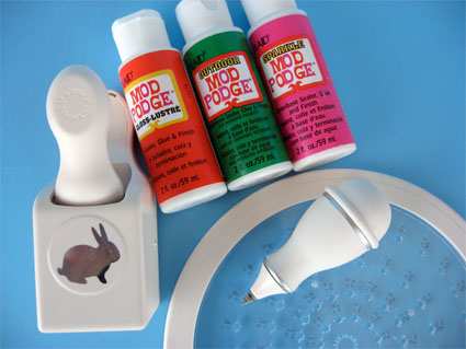 supplies for Easter pail craft: mod podge, circle cutter