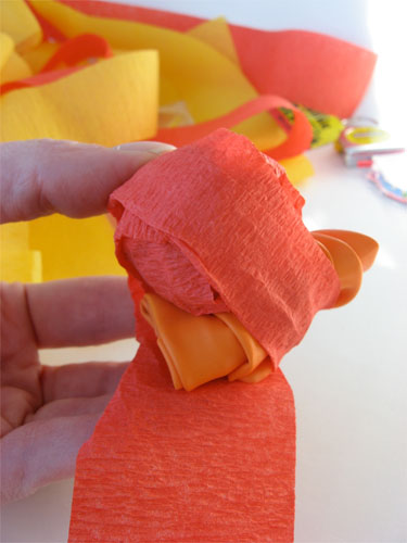 Orange and yellow crepe paper wrapped around treats