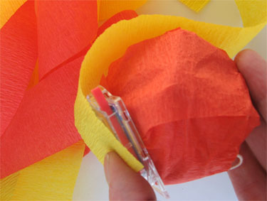 Wrapping treat with orange and yellow crepe paper