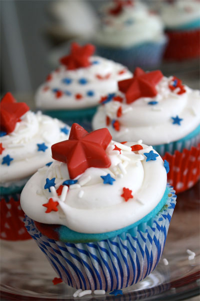 fourth of july cupcakes. Frost cupcakes, add some