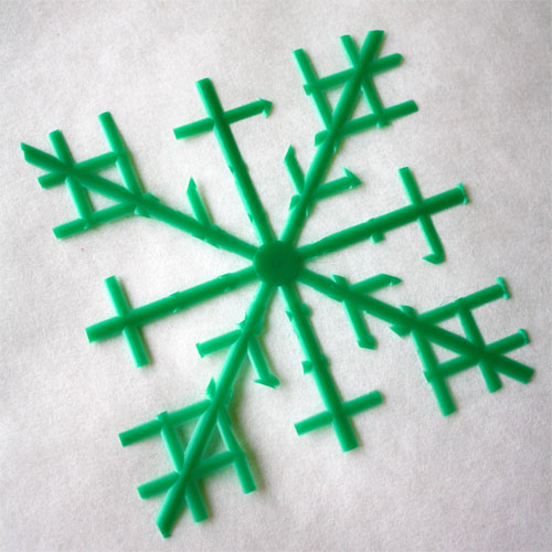 shape of snowflake made from plastic berry basket 