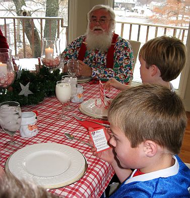 Boys playing are you smarter than a fifth grader with Santa at their breakfast. -Skip To My Lou