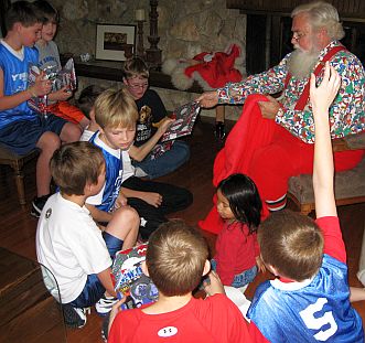 Santa handing out gifts to the boys basketball team during the breakfast with Santa.  -Skip To My Lou