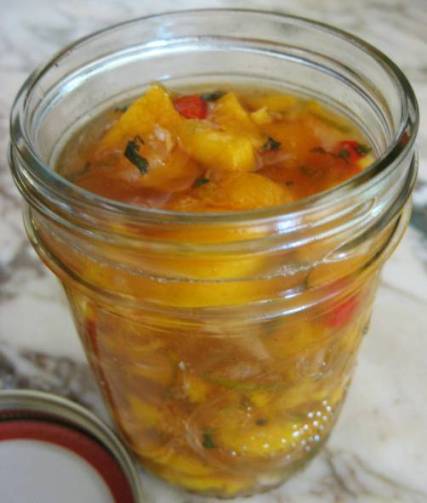 Peach salsa in canning jar without the lid
