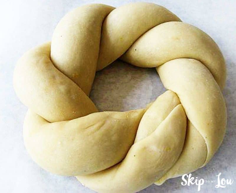 unbaked king king showing how to braid bread