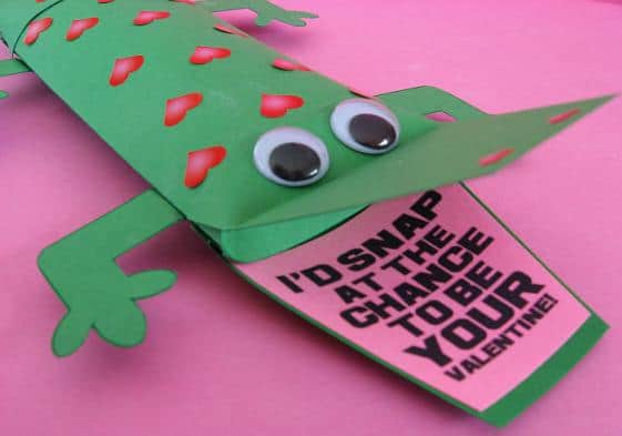 green valentine pillow box alligator with red hearts on it with the message, "I'd snap at the chance to be your Valentine!" in it's mouth