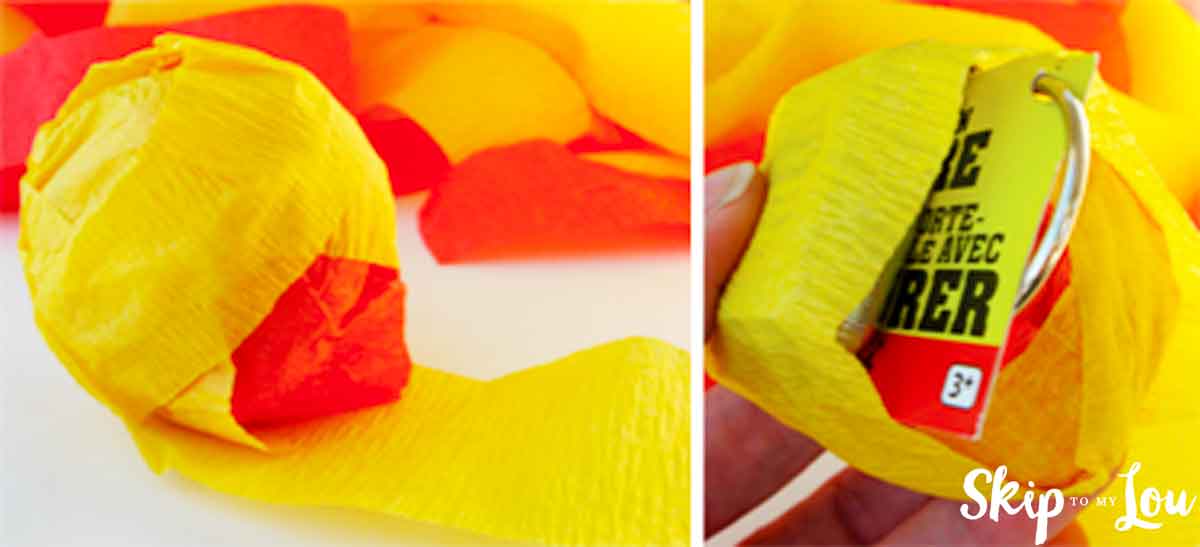 wrapping surpise ball with crepe paper to hide trinkets
