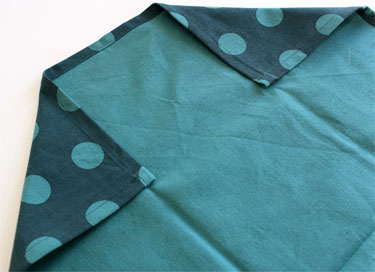 folded tea towel for cutting apron