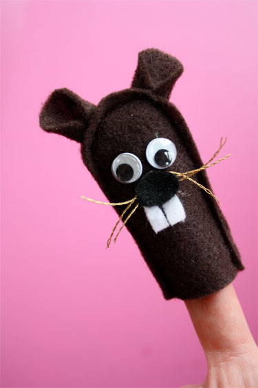 groundhog puppet on a finger