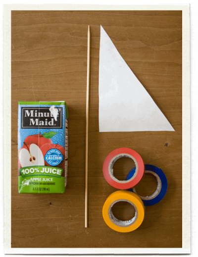 Juice Box Sailboat supplies: juice box, wooden skewer, Tyvex triangle for sail, colored tape