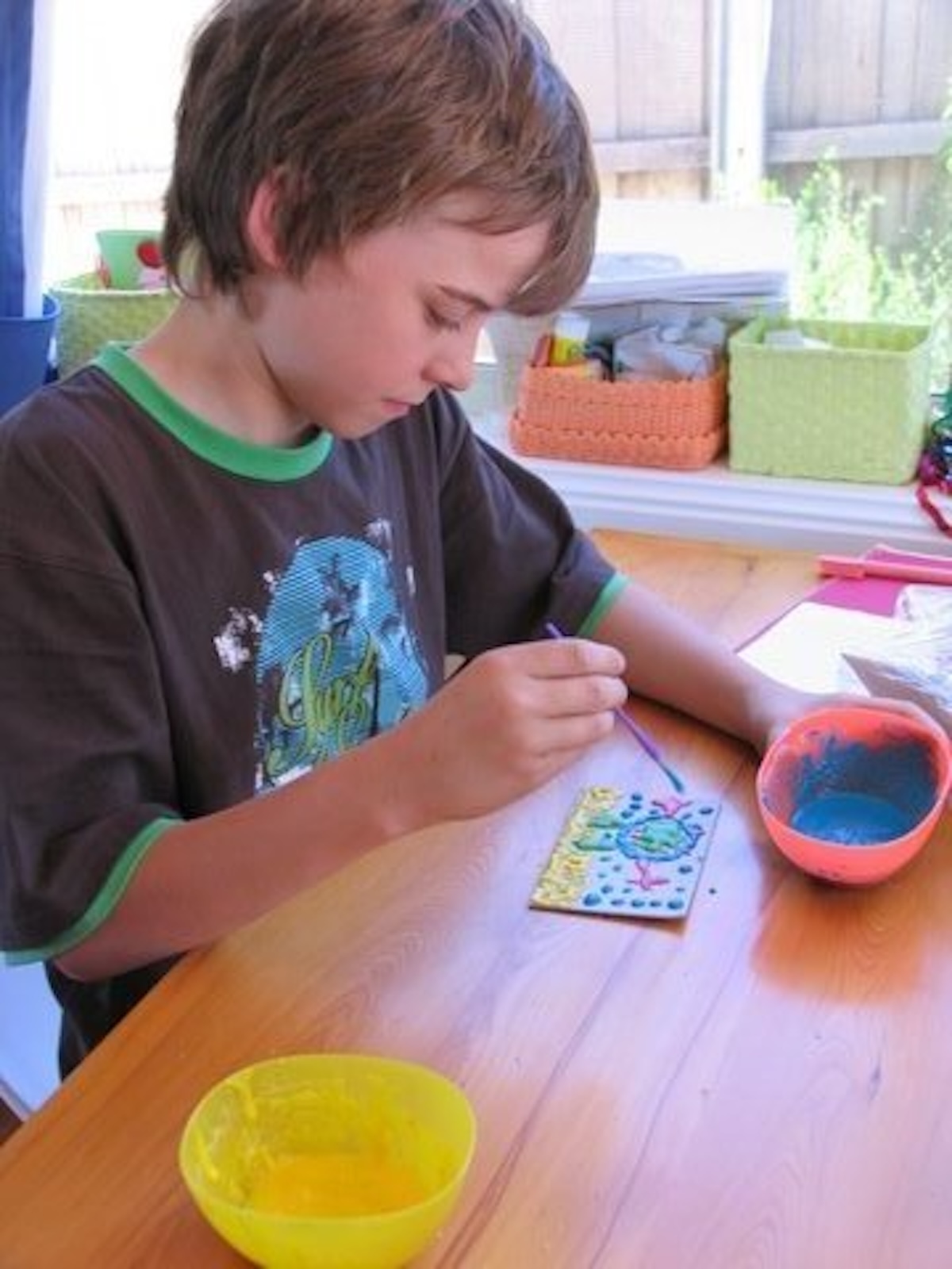 boy painting with puffy paint