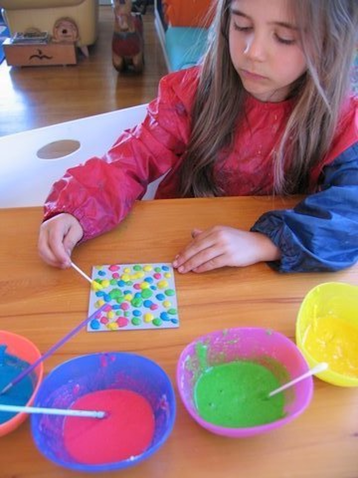 girl painting with DIY puffy paint