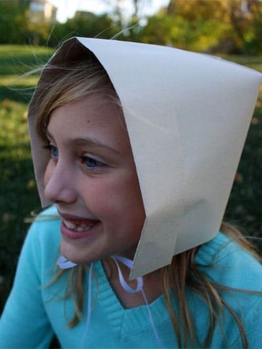 girl wearing pilgrim bonnet