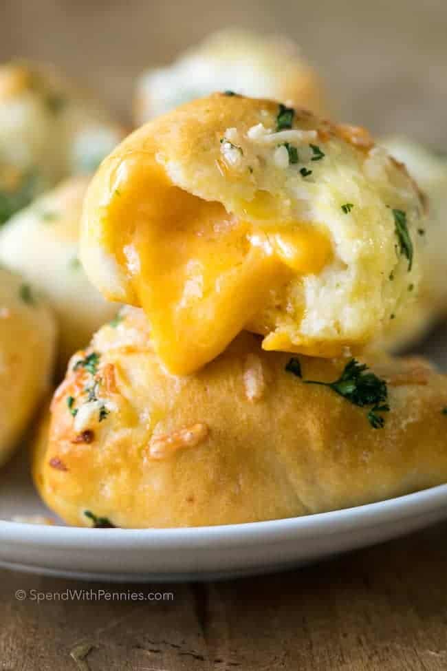 garlic cheddar biscuit broken apart cheese oozing out