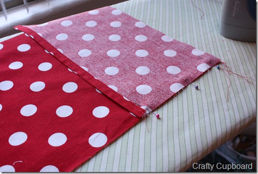 010 Pin the hemmed piece with it’s 8” side to the long side of your large polka-dot piece with raw edges even.