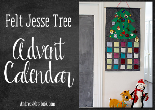 Felt advent calendar hanging on a wall with Christmas decoration next to it