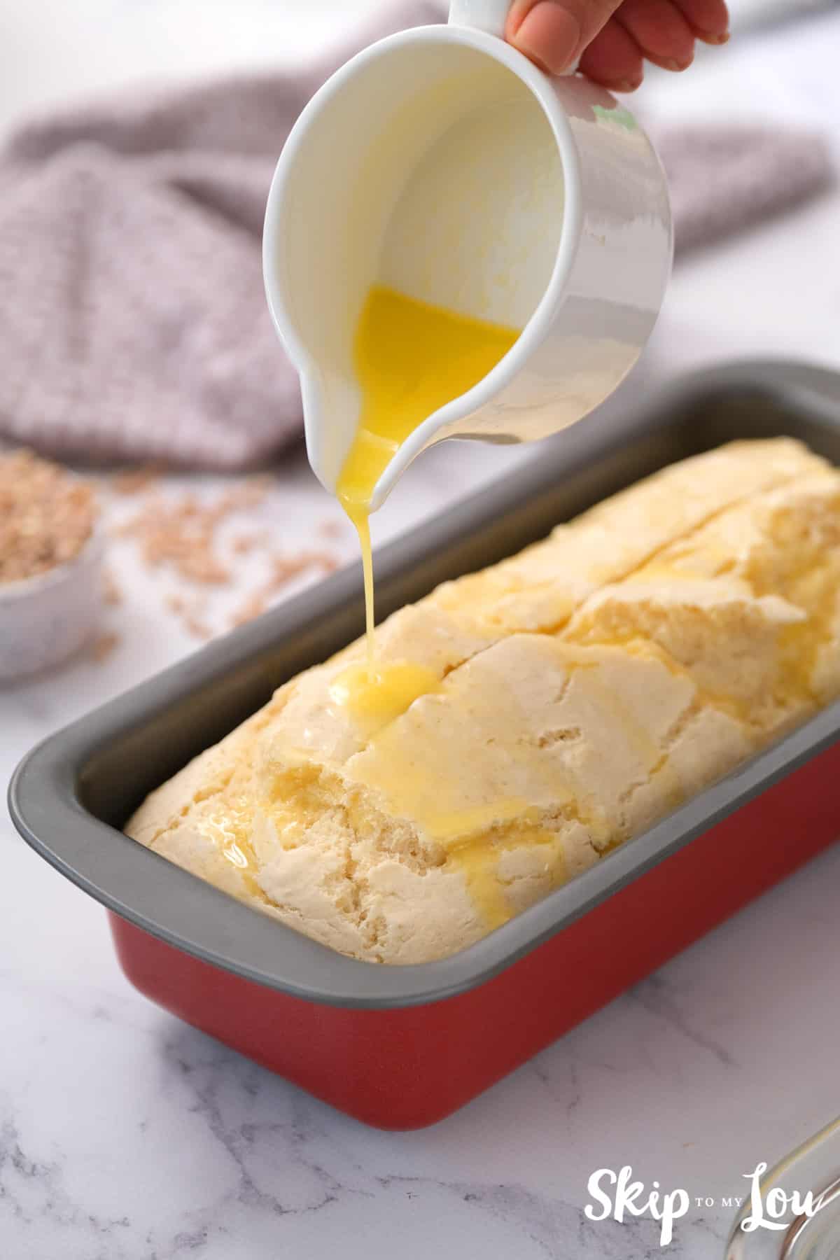 split top of loaf and pour on butter and bake for beer bread