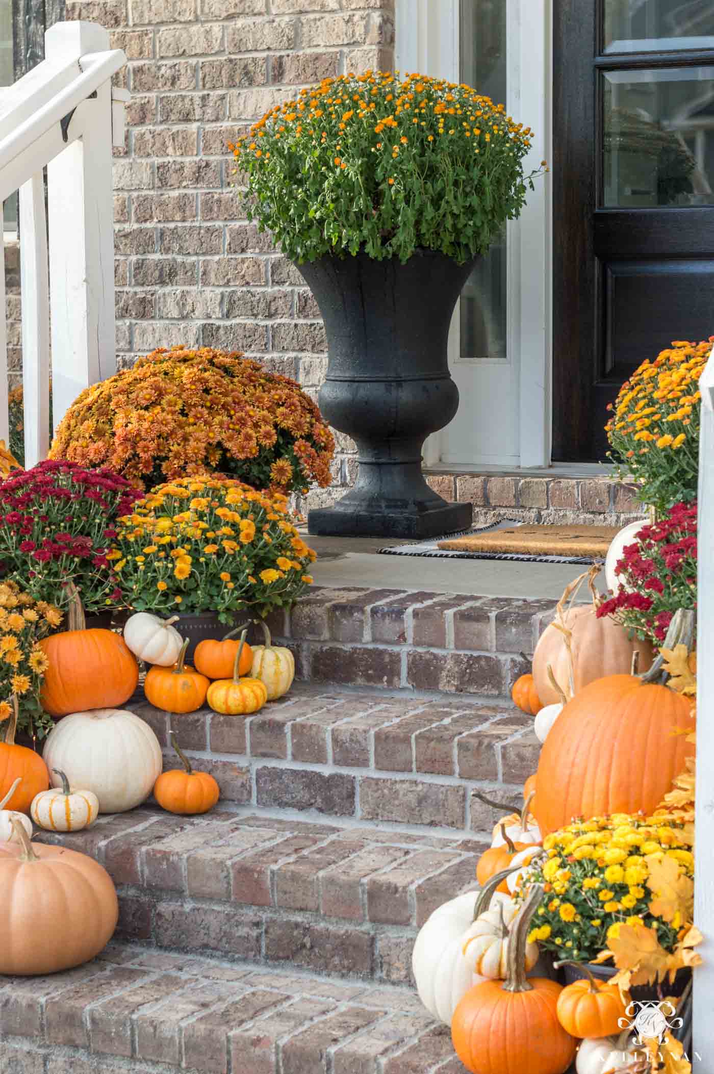 pumpkins and mums on front porch