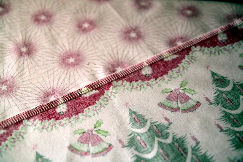 Holiday Tablecloth Tutorial sides pieces sewn together with right sides together with a 1/2" seam. -Skip To My Lou