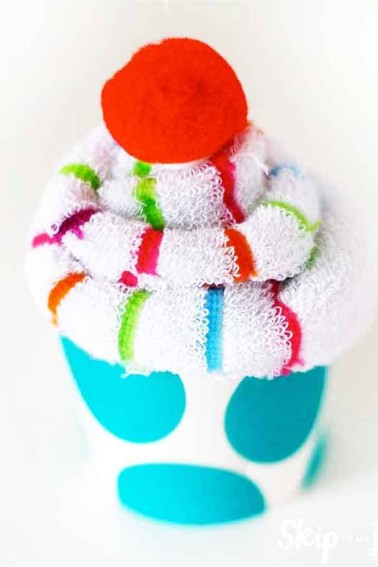 sock cupcake with red pom pom cherry
