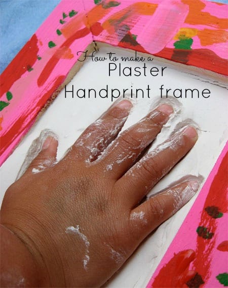 beautiful mother's day gift idea pink decorated frame with a hand pressing into plaster inside the frame - plaster handprint frame