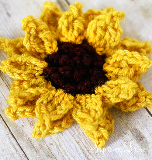 crochet sunflower with black yarn for the center and yellow yarn for the petals