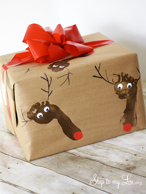 Gift wrapped in Reindeer DIY Wrapping Paper with a red bow