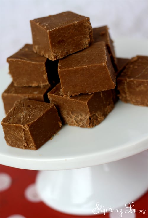 chocolate peanut butter fudge on white cake stand