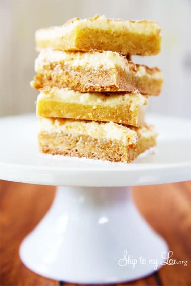 gooey butter bars on white cake pedestal