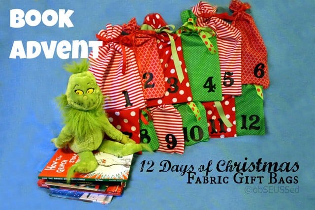 12 colorful fabric bags with black numbers to hold books for a countdown to Christmas. A stuffed Grinch is sitting on a stack of books.
