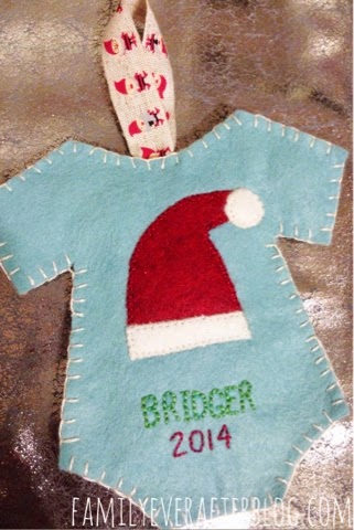 Completed Baby's First Ornament. Light blue onesie with Santa Hat, name, and year.
