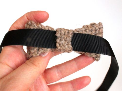 Step 4. Take your grosgrain ribbon and thread it through the center bow tie