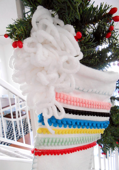 attach pom pom to stocking