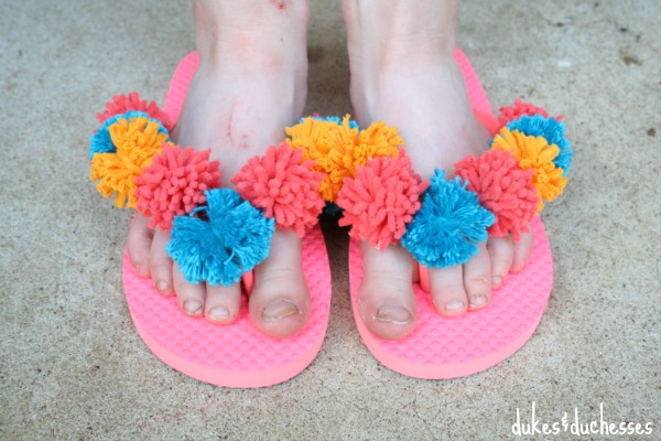 bright pom pom flip flops