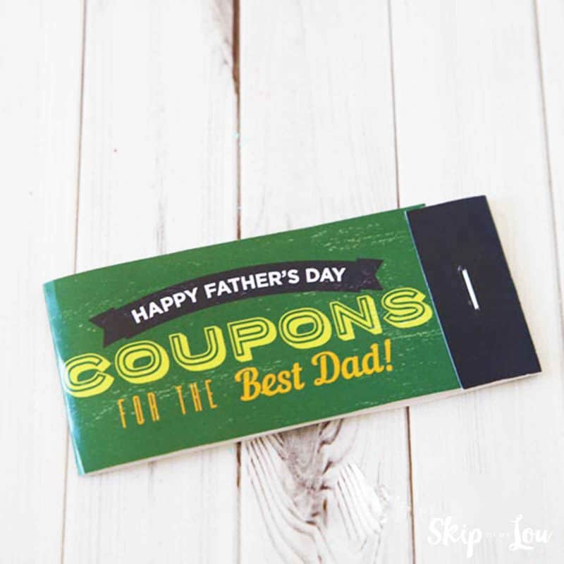 fathers day coupon book, the cover reads happy father's day coupons for the best dad; the cover is green with a black ribbon that reads happy father's day, the other fonts is yellow and orange