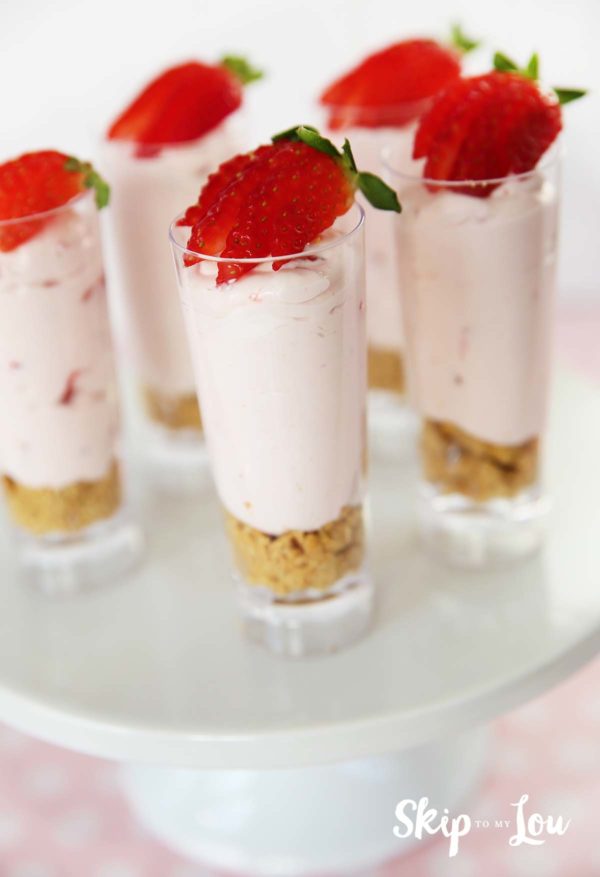 individual strawberry cheesecakes in tall cordial cups