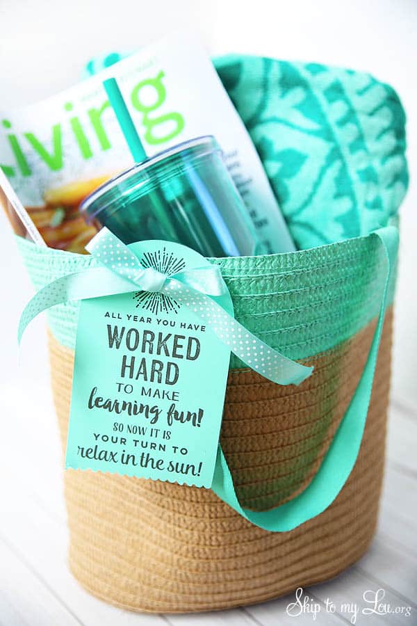 tote filled with relaxation summer items for teacher gift with a printable tag that reads,"all year you have worked hard to make learning fun! so now it is your turn to relax in the sun!"