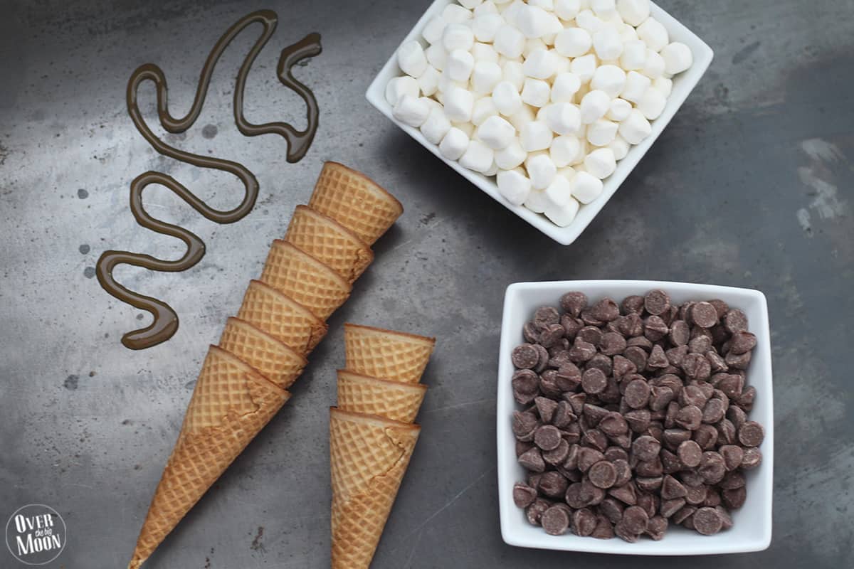Campfire cones! This no mess approach to S'mores is the best! You can bake them, BBQ them or cook them in a fire! From www.overthebigmoon.com!