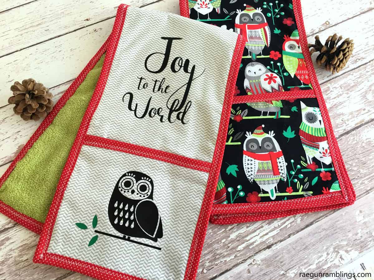 raegunrambling.com Two cute Christmas double potholders. One with the text Joy to the World with a cute owl. The other towel has a black background and festive owls and red trim. -Skip To My Lou