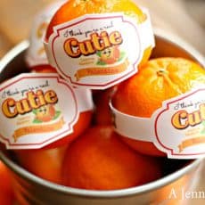oranges with cutie label in bucket