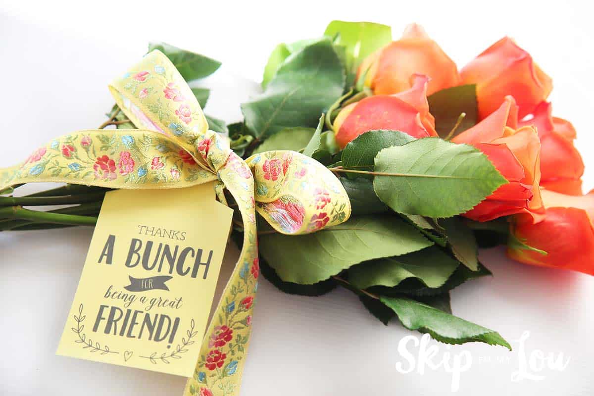 printable thanks a bunch for being a great friend tag attached to a bouquet of flowers