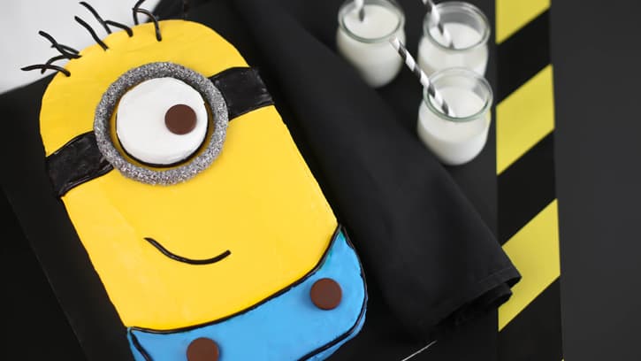minion cake with tootsie roll buttons