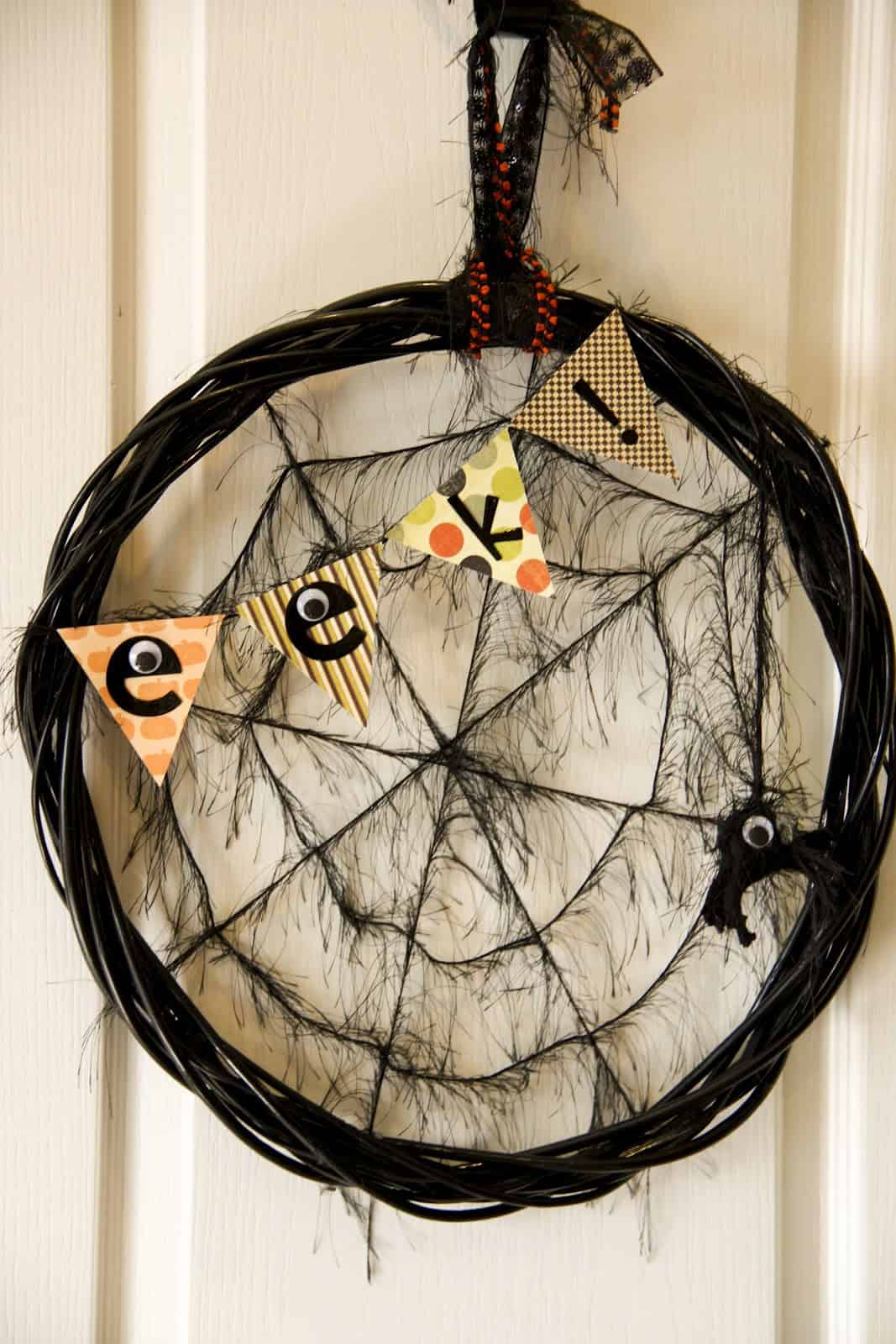 Black spider web with eek! sign door Halloween decoration