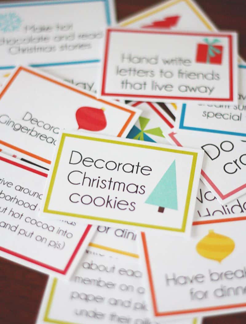 Scattered activity cards top card says decorate Christmas cookies