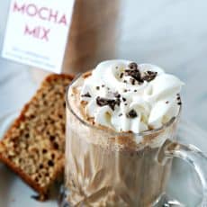 Mocha Mix served in a cut glass mug topped with whipped cream and chocolate, by Skip to my Lou