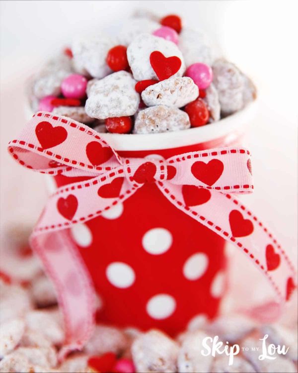 Valentine's Day Puppy Chow in red container with white hearts