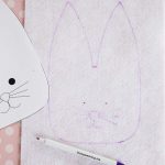 template of bunny traced onto white felt, including facial features, with disappearing fabric ink marker