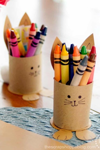 two brown bunny crayon holders full of crayons