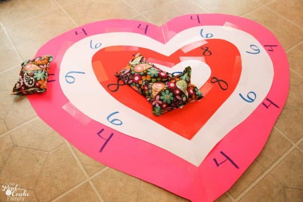 Valentine's Day bean bag toss, four tears of hearts with points in each layer with three bean bags